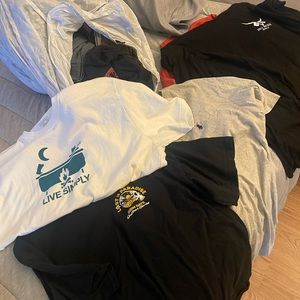 Bag of various short and long sleeve shirts